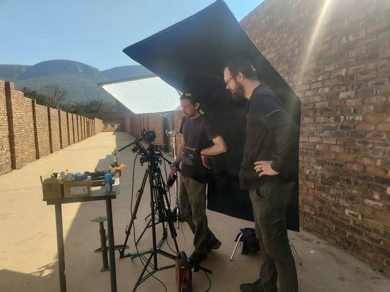Crew rigging a light on an outdoor desert set